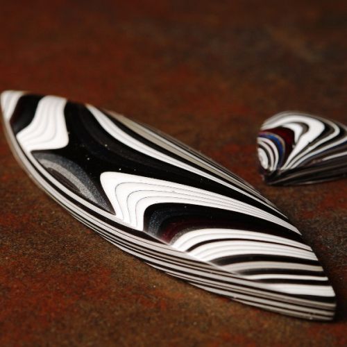 Fordite Cabochons displating the naturally formed organic patterns on the layers automotive paint over spray over the years.